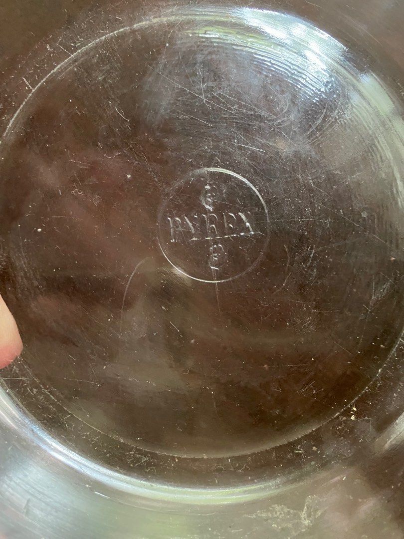 Pyrex Glass Baking Dish with Lid (Category: Bakeware) located in Pasig City. Submitted by ecochicsales (Listing ID 1416027646, Image 2). Description: - Pyrex glass baking dish with lid - Round shape with handles - Lid features a knob - Genuine Pyrex logo visible - Ideal for baking and serving.