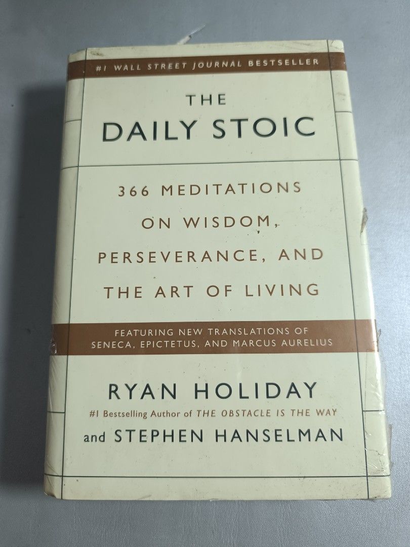 The Daily Stoic by Ryan Holiday (Category: Storybooks) located in Manila. Submitted by sejhuu (Listing ID 1416032214, Image 1). Description: [ORIGINAL - HARDBOUND] The Daily Stoic by Ryan Holiday and Stephen Hanselman. - Published by Penguin Books. - Includes quotes from Maria Popova, Gregory Hays, and Jack Canfield. > The book is slightly used, with visible crumple on cover edge > wrapped in cling wrap to protect the book while in storage Hi! ✨ 