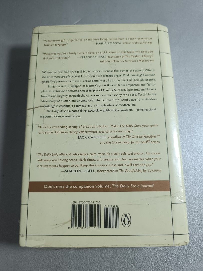 The Daily Stoic by Ryan Holiday (Category: Storybooks) located in Manila. Submitted by sejhuu (Listing ID 1416032214, Image 2). Description: [ORIGINAL - HARDBOUND] The Daily Stoic by Ryan Holiday and Stephen Hanselman. - Published by Penguin Books. - Includes quotes from Maria Popova, Gregory Hays, and Jack Canfield. > The book is slightly used, with visible crumple on cover edge > wrapped in cling wrap to protect the book while in storage Hi! ✨ 