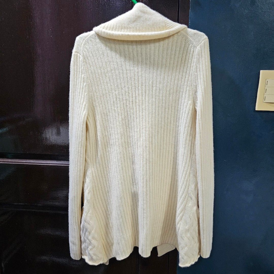 Tommy Hilfiger Cream Cardigan (Category: Coats, Jackets and Outerwear) located in Caloocan City. Submitted by e_o62059 (Listing ID 1416211079, Image 2). Description: Cream-colored Tommy Hilfiger cardigan. Features a shawl collar, two front pockets, and no buttons. Made in China. Size S/P. Sleeve length is 27 inches, shoulder width is 16 inches, and length is 28 inches. The cardigan has a textured design on the front pockets and sleeves. pristine 