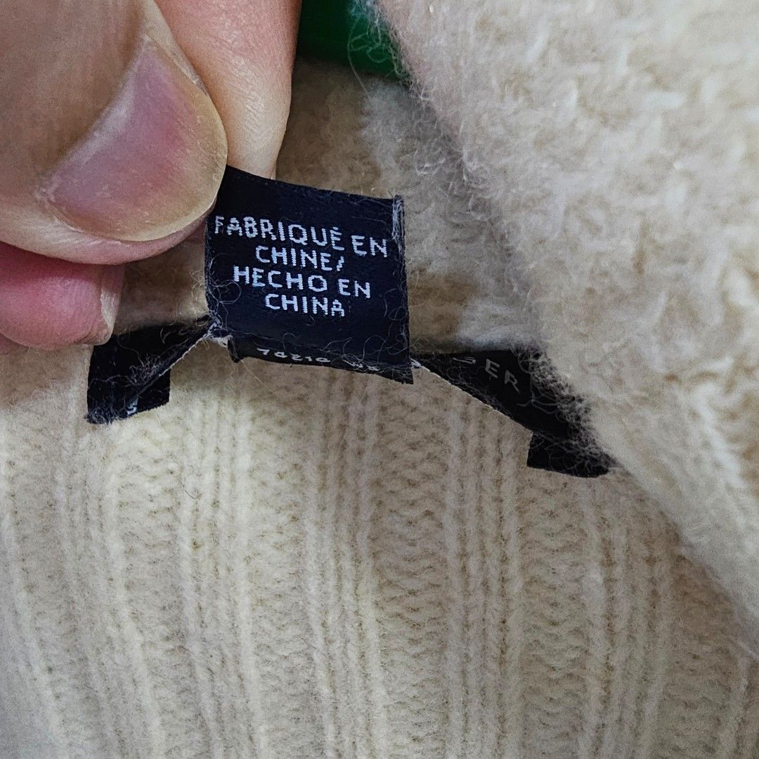 Tommy Hilfiger Cream Cardigan (Category: Coats, Jackets and Outerwear) located in Caloocan City. Submitted by e_o62059 (Listing ID 1416211079, Image 3). Description: Cream-colored Tommy Hilfiger cardigan. Features a shawl collar, two front pockets, and no buttons. Made in China. Size S/P. Sleeve length is 27 inches, shoulder width is 16 inches, and length is 28 inches. The cardigan has a textured design on the front pockets and sleeves. pristine 