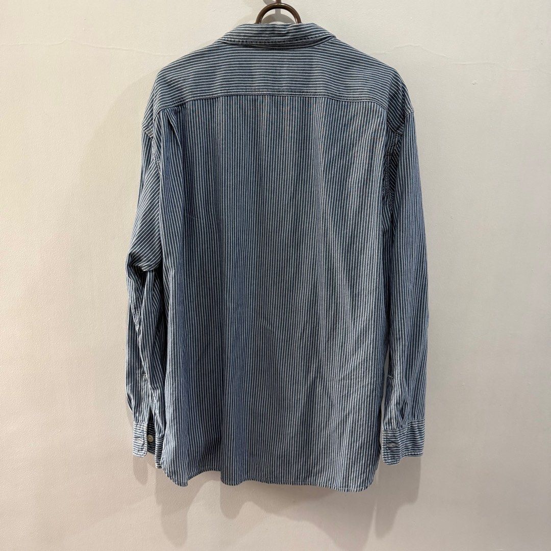 Uniqlo Striped Button-Down Shirt - Size L (Category: Shirts) located in Binan City. Submitted by ard__ (Listing ID 1416086161, Image 2). Description: - Uniqlo button-down shirt - Blue and white striped pattern - Size: Large (L) - Chest: 96-104 cm - Material: 100% Cotton - Features: Two chest pockets, classic collar - Made in Bangladesh.