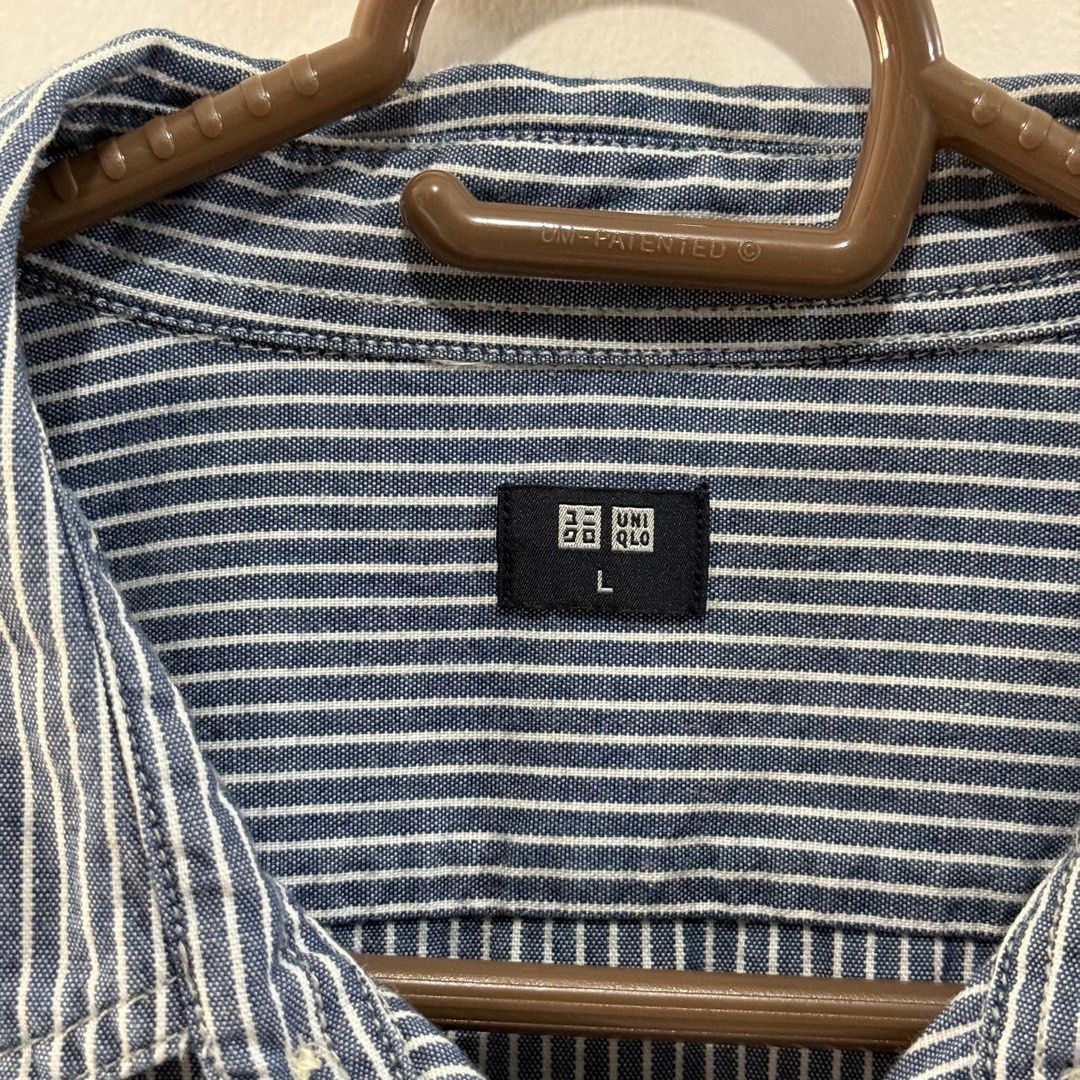 Uniqlo Striped Button-Down Shirt - Size L (Category: Shirts) located in Binan City. Submitted by ard__ (Listing ID 1416086161, Image 3). Description: - Uniqlo button-down shirt - Blue and white striped pattern - Size: Large (L) - Chest: 96-104 cm - Material: 100% Cotton - Features: Two chest pockets, classic collar - Made in Bangladesh.