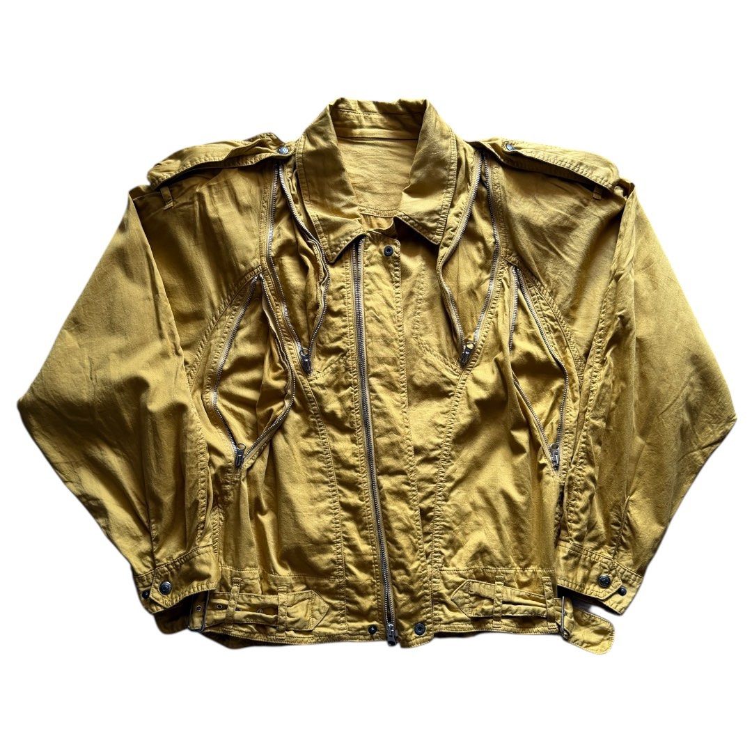 Vintage DiMaggio Japanese Utility Bomber Jacket (Category: Activewear) located in Zamboanga. Submitted by the.angura.store (Listing ID 1416028892, Image 2). Description: Vintage DiMaggio Japanese Utility Bomber Jacket This beautiful bomber jacket features multiple zippered pockets spread around the jacket that is very reminiscent of the Margiela 5-zip jacket. Cinched and snatched waist, double front closure (snap button/zipper) Detachable epaulet