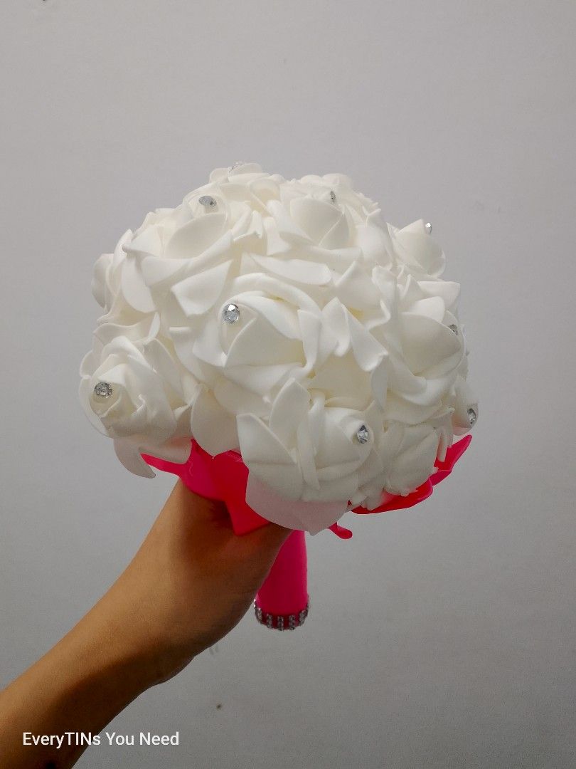 White Rose Wedding Bouquet with Pink Handle (Category: Flowers & Bouquets) located in Malabon City. Submitted by everytins_you_need (Listing ID 1416120851, Image 1). Description: BOUQUET FLOWER 1 pc available on hand, ready to ship/Lalamove or jnt. .