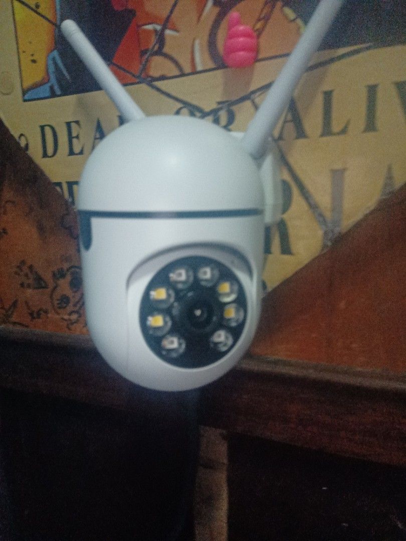 Wireless PTZ Security Camera (Category: Security Systems & CCTV Cameras) located in Manila. Submitted by wildeagle-dfd188 (Listing ID 1416157902, Image 1). Description: - Wireless security camera - White body with dual antennas - Circular lens with LED lights - Designed for indoor/outdoor use - PTZ (Pan-Tilt-Zoom) functionality - Remote viewing angle adjustment.