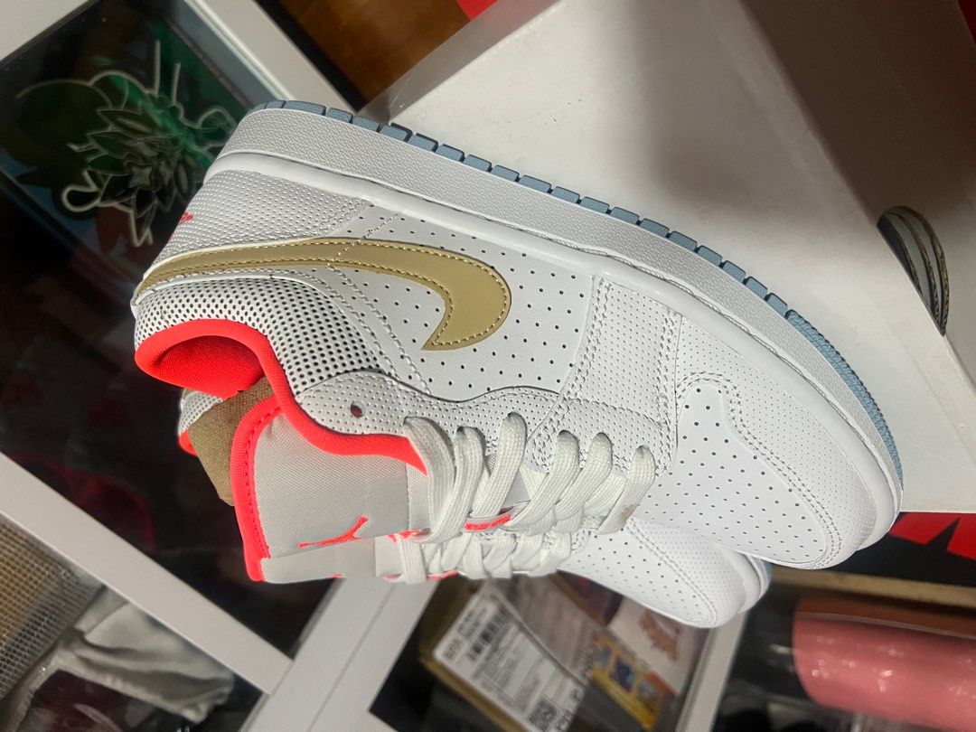 WMNS Air Jordan 1 Low SE (Category: Sneakers) located in Quezon City. Submitted by ammmilo (Listing ID 1416154103, Image 3). Description: - Air Jordan 1 Low SE sneakers - White upper with perforations - Gold swoosh - Coral-colored lining and accents - White midsole - Light blue outsole - Size: 7.5 US/ UK 5/ 24.5 cm - Includes original box Brand New, Unfitted (Dead stock) RFS: previously collecting, downsizing home Bought at SRP 5,500 Initially se