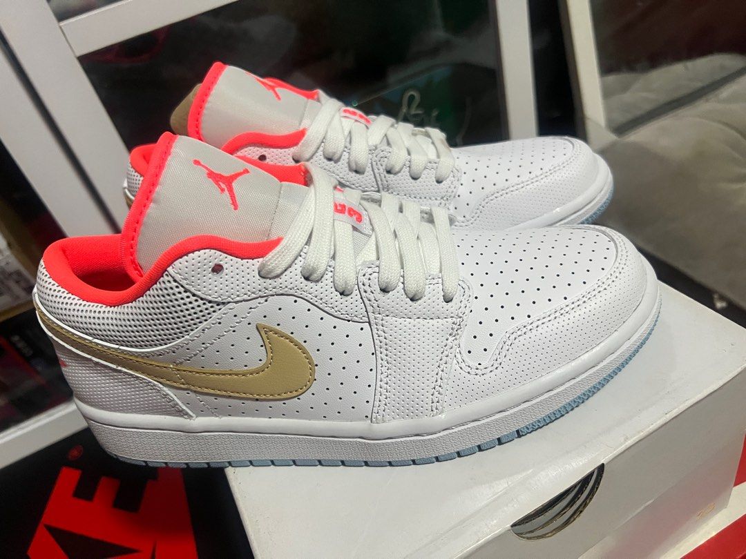 WMNS Air Jordan 1 Low SE (Category: Sneakers) located in Quezon City. Submitted by ammmilo (Listing ID 1416154103, Image 2). Description: - Air Jordan 1 Low SE sneakers - White upper with perforations - Gold swoosh - Coral-colored lining and accents - White midsole - Light blue outsole - Size: 7.5 US/ UK 5/ 24.5 cm - Includes original box Brand New, Unfitted (Dead stock) RFS: previously collecting, downsizing home Bought at SRP 5,500 Initially se