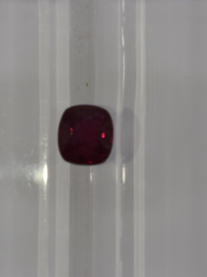 2.40cts Ruby (Category: Precious Stones) located in Singapore. Submitted by angmokio7921 (Listing ID 1416297466, Image 1). Description: Item: Ruby Wt: 2.40cts Color: Vivid Red Dim: 7.30*6.79*5.12mm Shape: Rectangle cushion cut COO: Mozambique Cert: CGL Comments: No indication of heating.