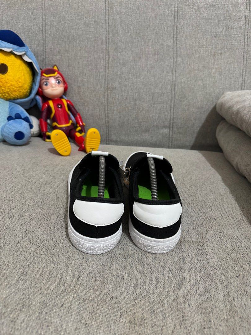 Adidas Slip-On Black and White (Category: Sneakers) located in Taguig. Submitted by declutterme12 (Listing ID 1416222364, Image 2). Description: - Adidas slip-on shoes - Color: Black upper, white sole - Adidas logo on tongue and sole - Includes original tag - Unworn condition.