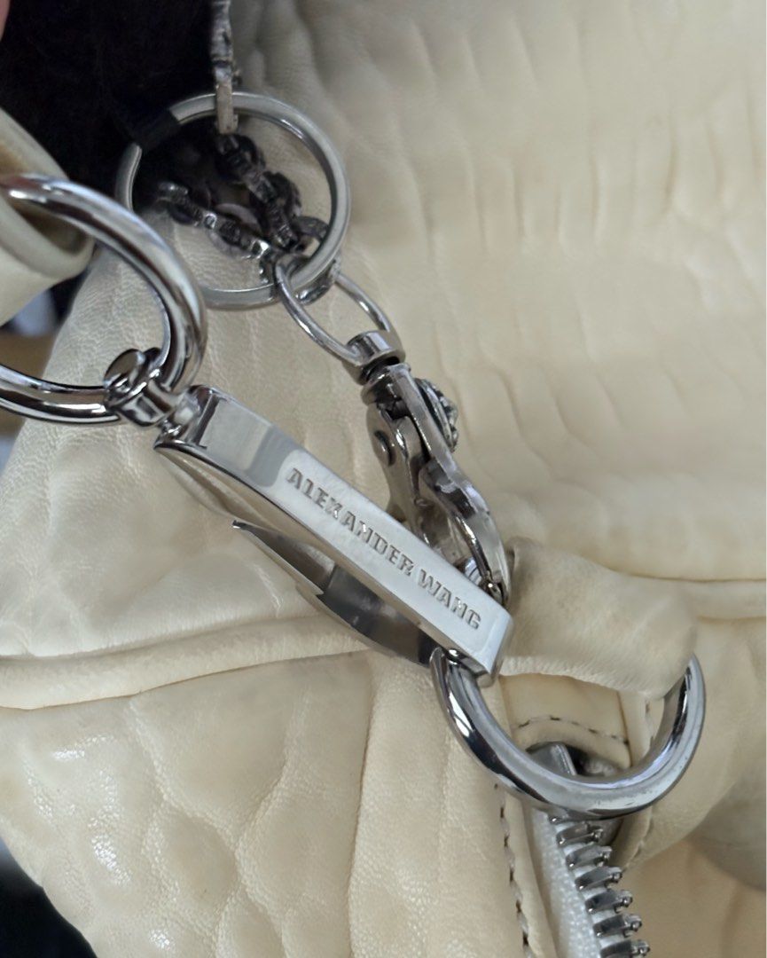 (SOLD) Alexander Wang Rocco Duffel Bag Vanilla (Category: Luxury Bags & Wallets) located in Marikina City. Submitted by gisellesniche (Listing ID 1415575049, Image 3). Description: - Authentic - 5,000 last price - Like new! no flaws. Complete rivets at the bottom & no discoloration on the leather yet - Authentic, dm for more details - Includes adjustable strap which can also be worn as a crossbody.