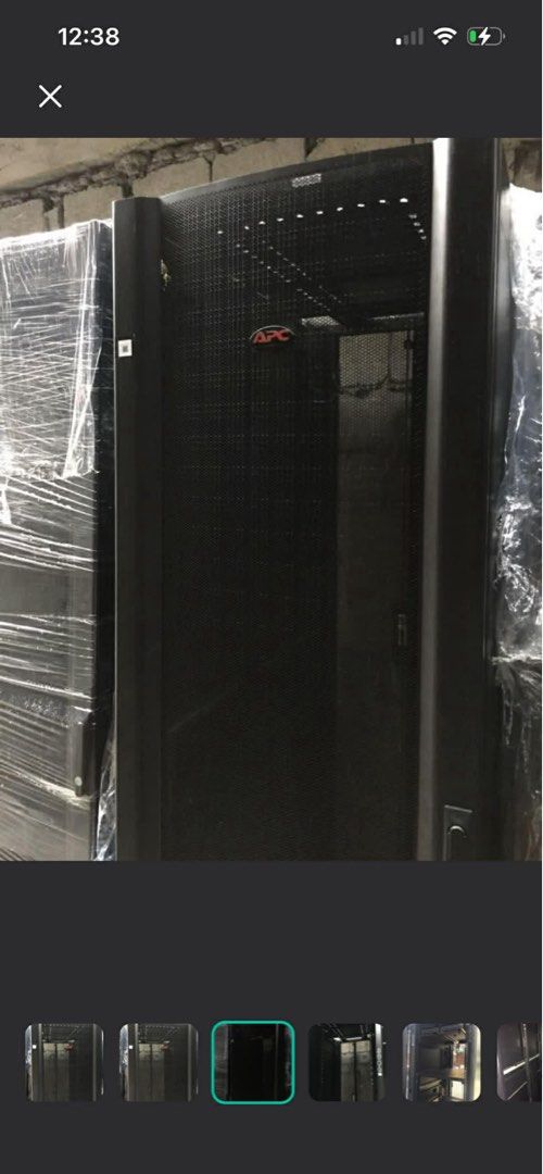 APC Server Rack 42U (Category: Office & Business Technology) located in Makati City. Submitted by myapplegates (Listing ID 1416389185, Image 1). Description: - APC server rack - Features TrueNet 5eT modules with RJ45 ports - Includes rack frame and mounting rails - Black exterior - Perforated front door with APC logo - Interior with mounting brackets.