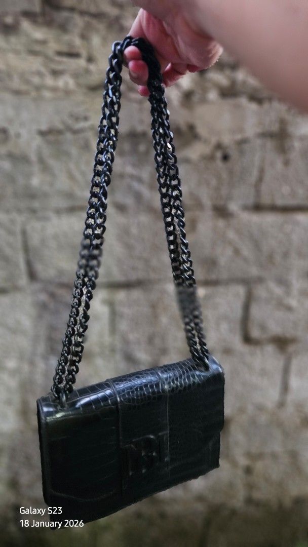 Badgley Mischka Black Handbag (Category: Luxury Bags & Wallets) located in Batangas. Submitted by teacherpaw (Listing ID 1416326352, Image 1). Description: - Badgley Mischka black handbag - Zippered interior pocket - Spacious main compartment - Soft fabric interior lining - Textured exterior (possibly faux leather) - Brand tag visible.
