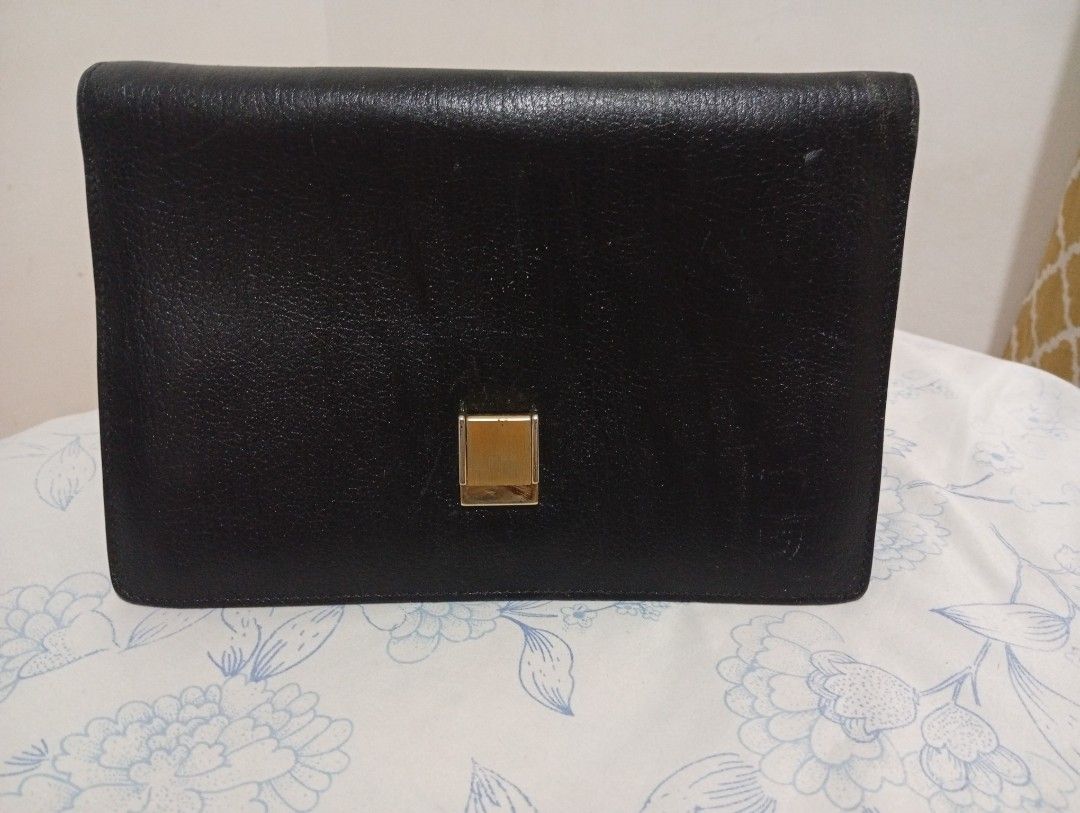 Bally Black Leather Clutch (Category: Luxury Bags & Wallets) located in Quezon City. Submitted by mcenon35 (Listing ID 1416364343, Image 1). Description: - Authentic Bally clutch - Black leather exterior - Gold-tone clasp - Gold Bally logo inside - Interior: Multiple compartments, zippered pocket, card slots, and snap closure pocket - Made in Italy.