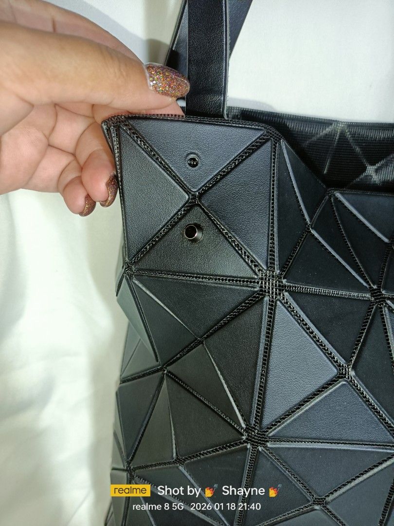 Baobao Issey Miyake Lucent Matte Black Tote (Category: Luxury Bags & Wallets) located in Bolinao. Submitted by shayne_0215 (Listing ID 1416388540, Image 3). Description: Authentic Japan Source Only has one missing rivet (see 3rd pic) MOP: GCASH.
