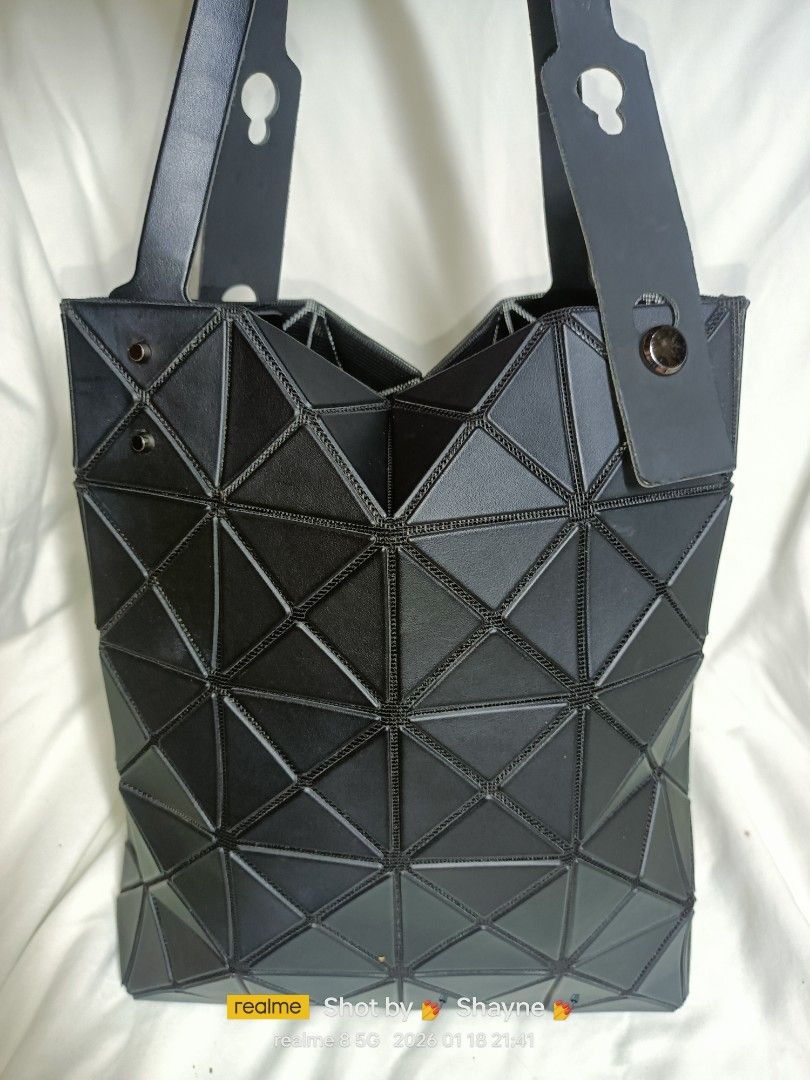 Baobao Issey Miyake Lucent Matte Black Tote (Category: Luxury Bags & Wallets) located in Bolinao. Submitted by shayne_0215 (Listing ID 1416388540, Image 1). Description: Authentic Japan Source Only has one missing rivet (see 3rd pic) MOP: GCASH.