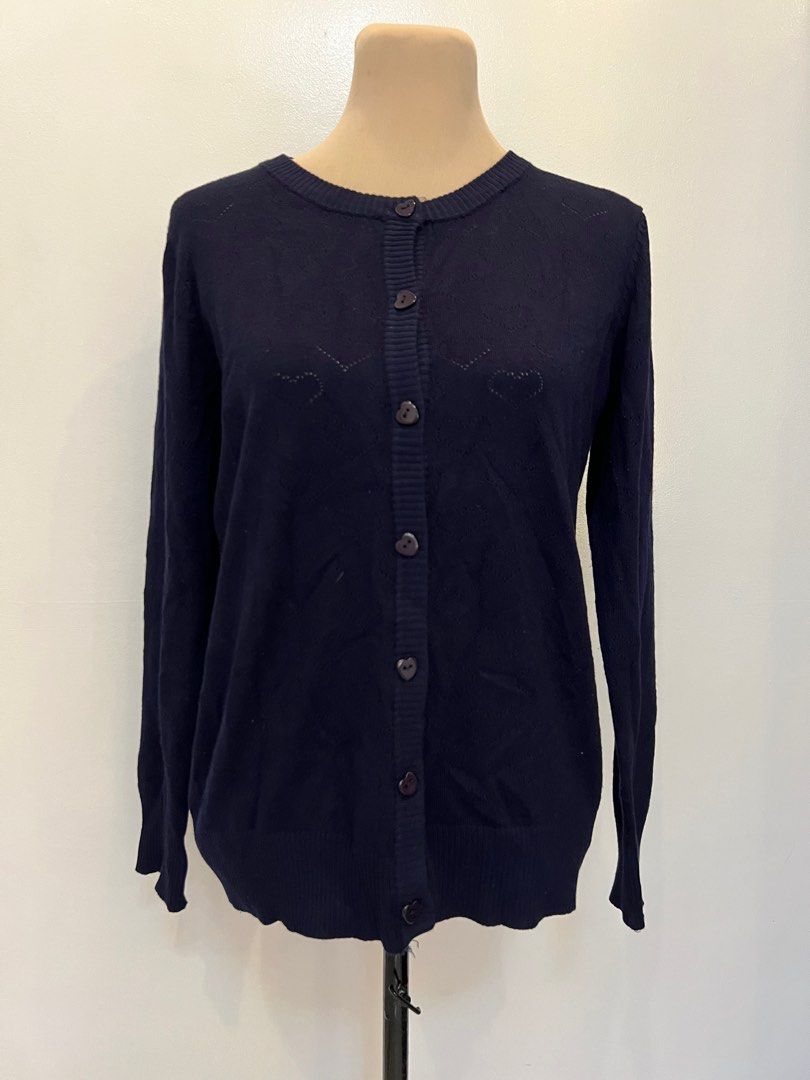 Bayo Navy Blue Cardigan (Category: Coats, Jackets and Outerwear) located in Quezon City. Submitted by annemargarethh (Listing ID 1416267248, Image 1). Description: - Love by Bayo navy blue cardigan - Size: L - Features a round neckline - Button-down closure - Adorned with heart-shaped cutouts and buttons - Great for layering - A versatile wardrobe essential.