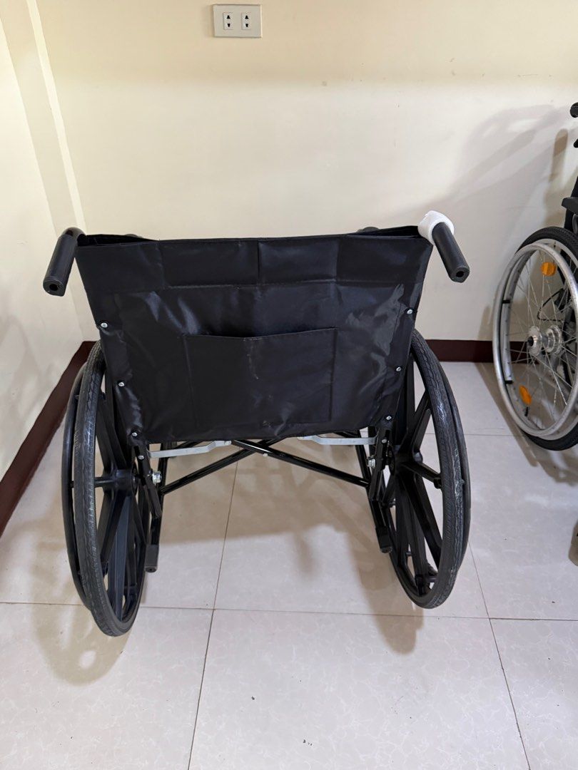 Black Wheelchair (Category: Wheelchairs) located in Cainta. Submitted by reabilty (Listing ID 1416237206, Image 2). Description: - Black foldable wheelchair - Includes footrests and armrests - Comfortable black fabric backrest - Provides mobility assistance.