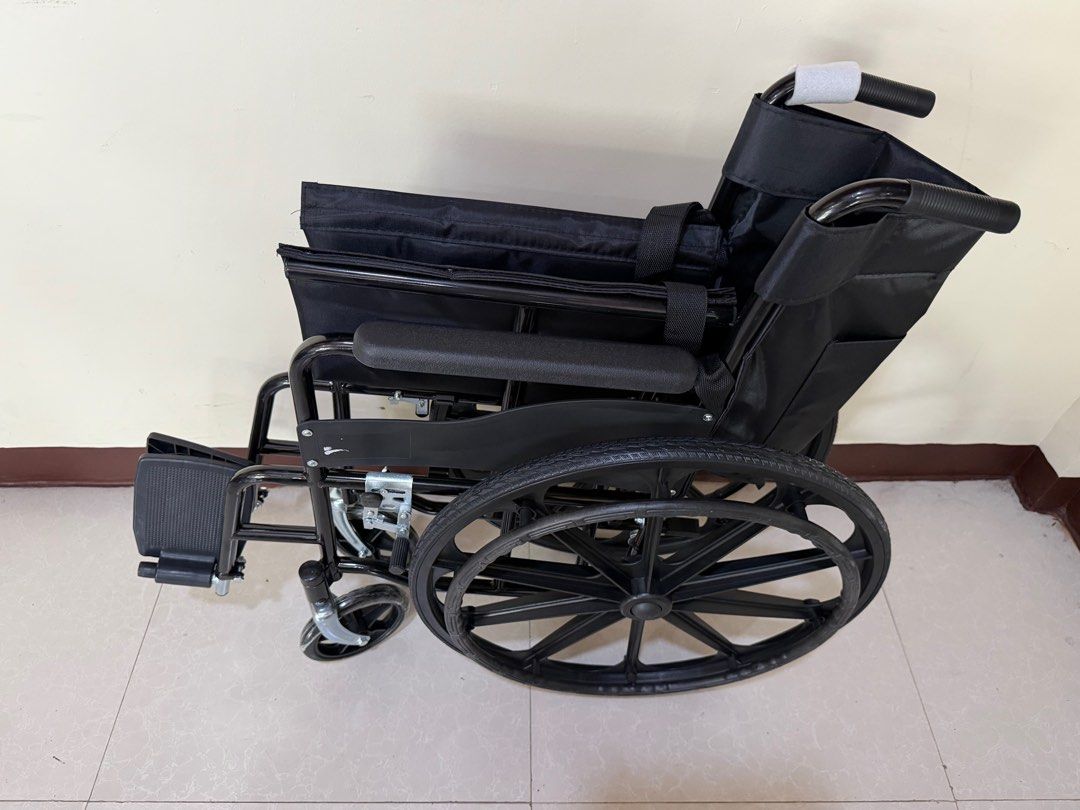 Black Wheelchair (Category: Wheelchairs) located in Cainta. Submitted by reabilty (Listing ID 1416237206, Image 3). Description: - Black foldable wheelchair - Includes footrests and armrests - Comfortable black fabric backrest - Provides mobility assistance.
