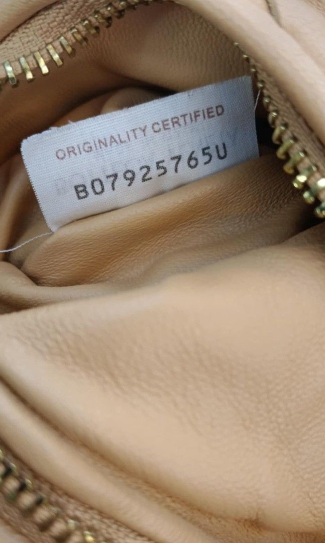 Bottega Veneta Mini Jodie (Category: Luxury Bags & Wallets) located in Legazpi City. Submitted by georgepine07142 (Listing ID 1416280141, Image 2). Description: Preloved Bottega Veneta Mini Jodie Leather Handbag – Almond Crafted from Bottega Veneta’s signature intrecciato leather in a beautiful almond shade. This Mini Jodie is compact yet stylish, perfect for elevating both casual and dressy looks. Soft leather, iconic knotted handle, and timeles