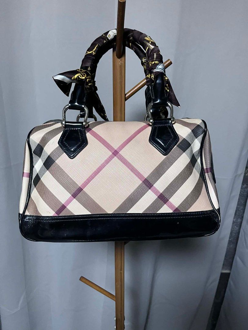 Burberry Nova Check Boston Bag (Category: Luxury Bags & Wallets) located in Quezon City. Submitted by carmeladelacruz82 (Listing ID 1416395080, Image 1). Description: - AUTHENTIC Burberry Nova Check Boston Bag - Material: Canvas and Leather - no dust bag or box - Condition: No major flaws - Issue: just has some scuffs on canvas and a bit of peeling sa ilalim ng bag (see last pictures).