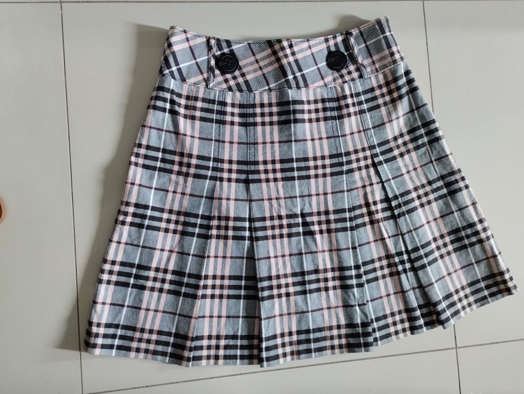 Burberry Plaid Pleated Skirt (Category: Skirts) located in Mabalacat. Submitted by uniqlover (Listing ID 1416266998, Image 1). Description: - Pleated design zipper closure - Solid-colored lining - Brand tag visible.