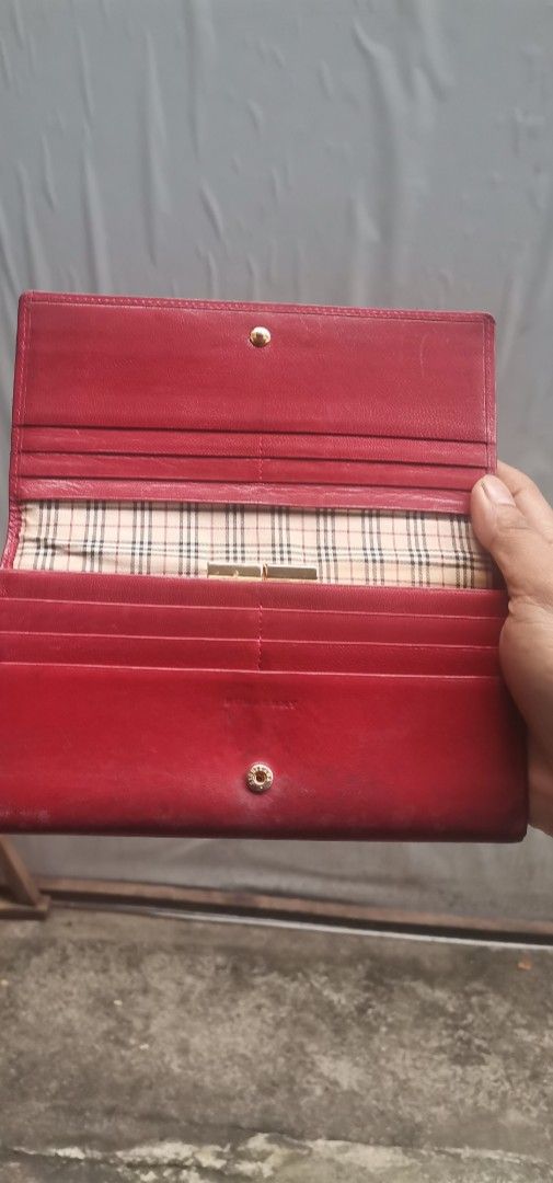 Burberry Red Leather Wallet (Category: Luxury Bags & Wallets) located in Quezon City. Submitted by akosiahcap95300 (Listing ID 1416430004, Image 2). Description: - Authentic Burberry red leather wallet - Multiple compartments for cards and cash - Classic Burberry check lining - Secure snap closure - Stylish kiss-lock closure - Crafted from premium leather.