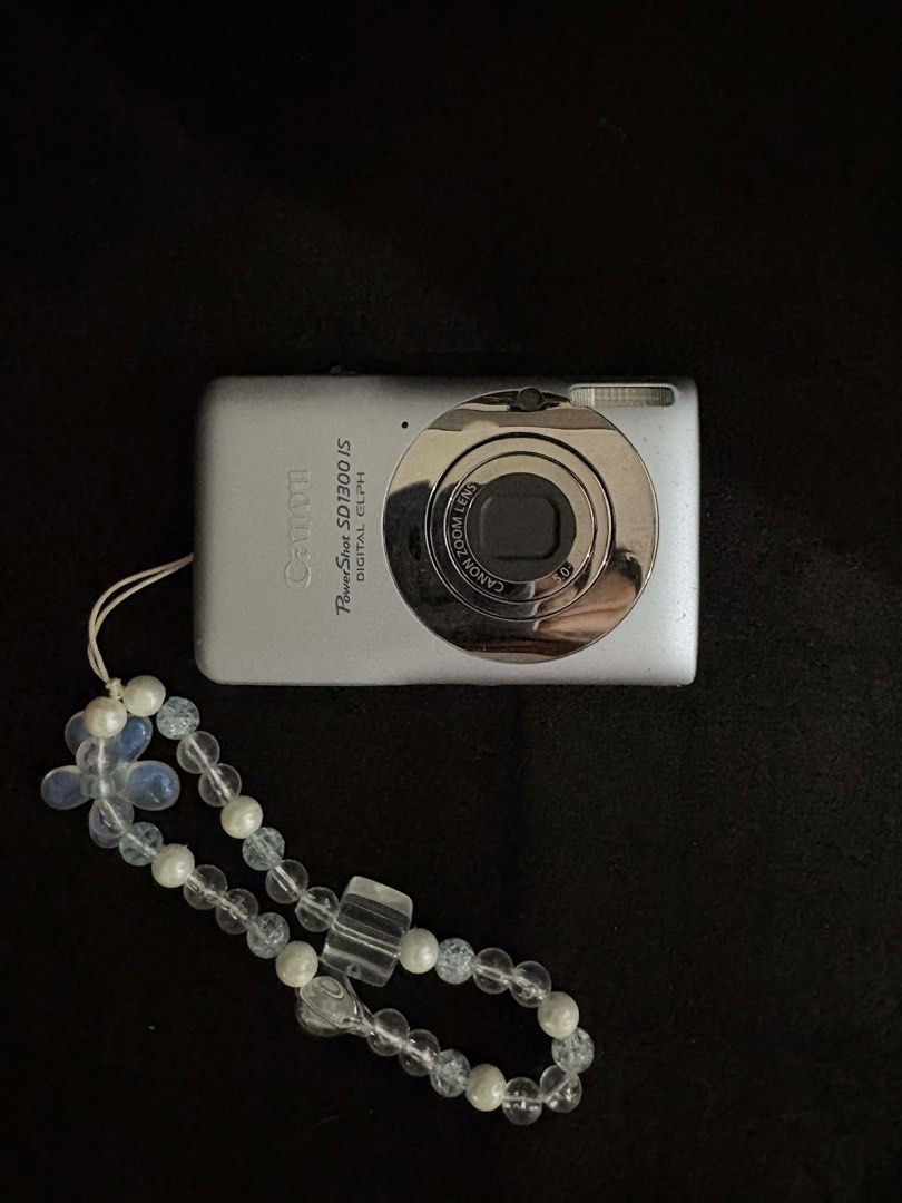 Canon PowerShot SD1300 IS Digital ELPH Digital Camera Digicam (Category: Cameras) located in Bacoor. Submitted by n.ihaoo (Listing ID 1416232263, Image 1). Description: * CRISP SHOTS (affordable canon g7x qual) * 12.1 MP - 1/2.3-inch CCD Sensor * ISO 80 - 1600 * 28-112 mm F2.8-5.9 Zoom Lens * Optical Image Stabilization * 2.70” Fixed Type Screen * 1.0fps continuous shooting * 140g. 91 x 56 x 22 mm * also known as IXUS 105 / IXY 200F * has 4x opti