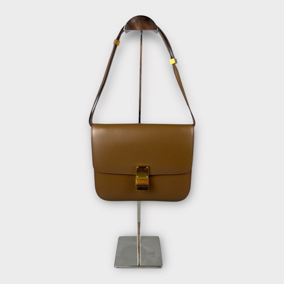 CELINE - Classic Calfskin Push-lock Closure Box Shoulder Bag (Category: Shoulder Bags) located in Los Banos. Submitted by declutterking (Listing ID 1416370106, Image 3). Description: One size • leather body • adjustable and detachable flat leather strap • front flap with a metal clasp closure • interior zip and slip pockets • brown Dimensions: 9.5" width 7.5" height 2.5" depth Excellent condition Authentic.