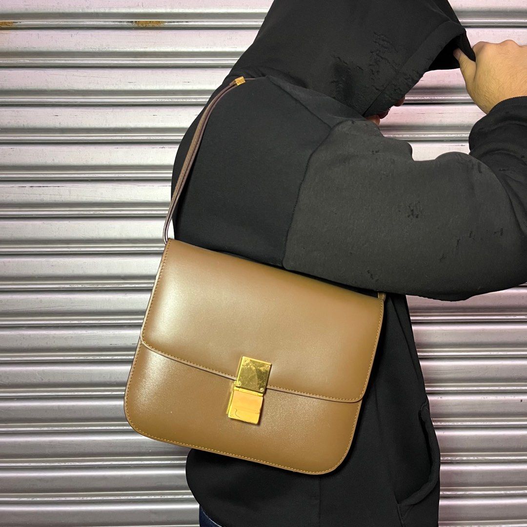 CELINE - Classic Calfskin Push-lock Closure Box Shoulder Bag (Category: Shoulder Bags) located in Los Banos. Submitted by declutterking (Listing ID 1416370106, Image 2). Description: One size • leather body • adjustable and detachable flat leather strap • front flap with a metal clasp closure • interior zip and slip pockets • brown Dimensions: 9.5" width 7.5" height 2.5" depth Excellent condition Authentic.