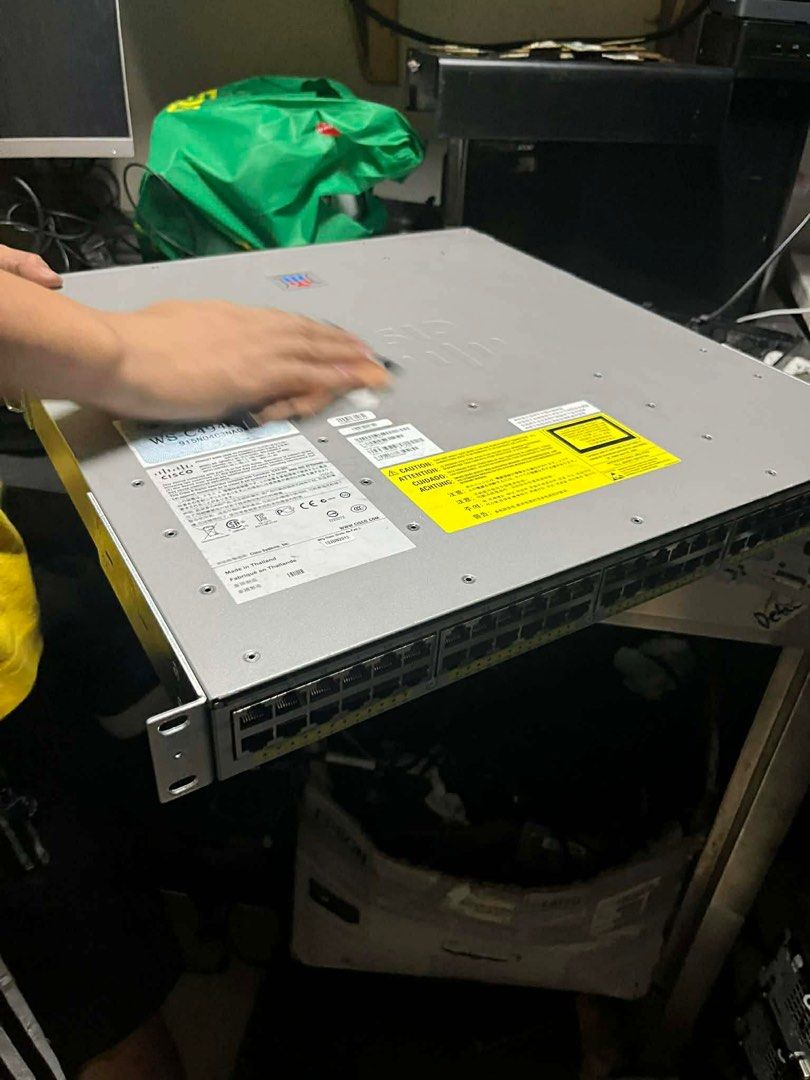 Cisco Catalyst 4948E-F Switch (Category: Networking) located in Makati City. Submitted by myapplegates (Listing ID 1416390048, Image 3). Description: - Cisco Catalyst 4948E-F switch - Multiple Ethernet ports - Power supply status indicator - Fan status indicator - Reset button - Visible model number - Silver color.