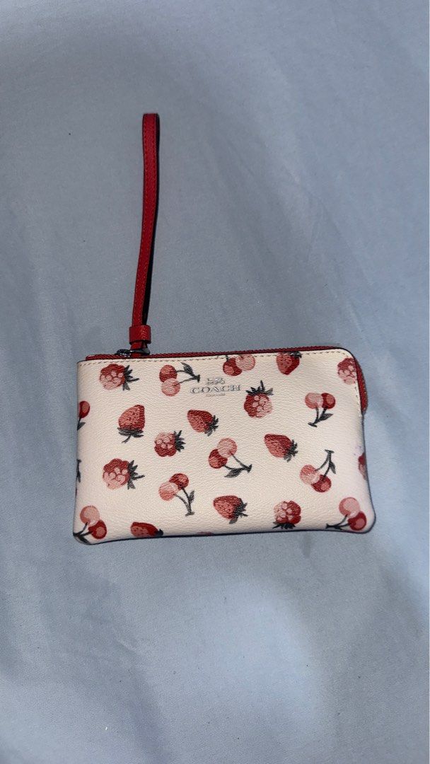 Coach Strawberry Print Wristlet (Category: Luxury Bags & Wallets) located in Manila. Submitted by declutterxvictoria (Listing ID 1416415523, Image 1). Description: Barely used .