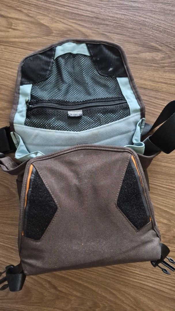 Crumpler Camera Bag Five Million Dollar (Category: Camera Bags & Carriers) located in Quezon City. Submitted by mythandmine (Listing ID 1416231614, Image 3). Description: - Crumpler camera bag - Stylish brown and orange design - Black strap included - Main compartment with mesh pocket - Secure zippered closure - Front flap with Crumpler logo - Designed for camera equipment 📍E Rodriguez Quezon City .