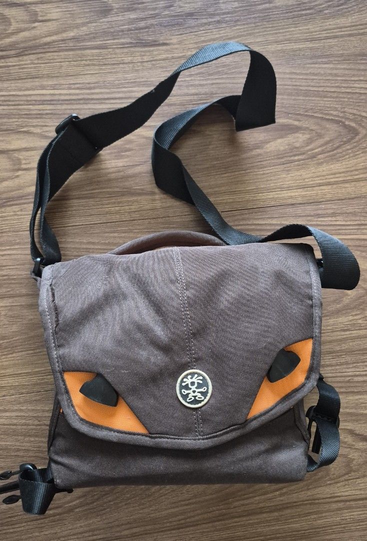 Crumpler Camera Bag Five Million Dollar (Category: Camera Bags & Carriers) located in Quezon City. Submitted by mythandmine (Listing ID 1416231614, Image 1). Description: - Crumpler camera bag - Stylish brown and orange design - Black strap included - Main compartment with mesh pocket - Secure zippered closure - Front flap with Crumpler logo - Designed for camera equipment 📍E Rodriguez Quezon City .