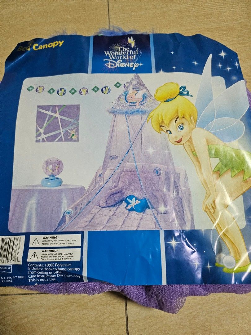 Disney Tinkerbell Bed Canopy (Category: Bedding & Towels) located in Makati City. Submitted by shopdoc (Listing ID 1416399722, Image 1). Description: - Disney Tinkerbell Canopy - Purple design with Tinkerbell graphics - Blue trim with feather accents - Made of durable polyester - Part of the Wonderful World of Disney collection.