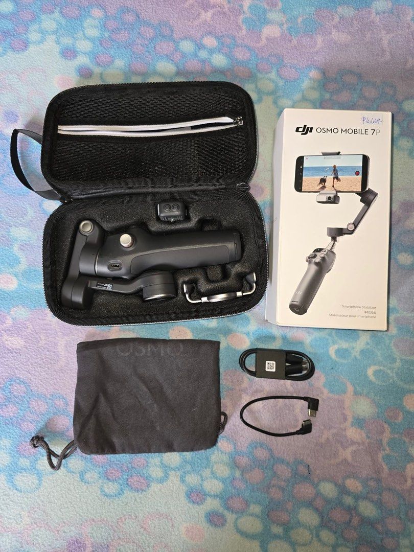 DJI Osmo Mobile 7P Smartphone Stabilizer (Category: Gimbals & Stabilizers ) located in Binan City. Submitted by rsmrz_99 (Listing ID 1416431836, Image 1). Description: - Bought for ₱6,669 from Henry's Camera Uptown BGC - Used only once (just to test) - Complete inclusions.