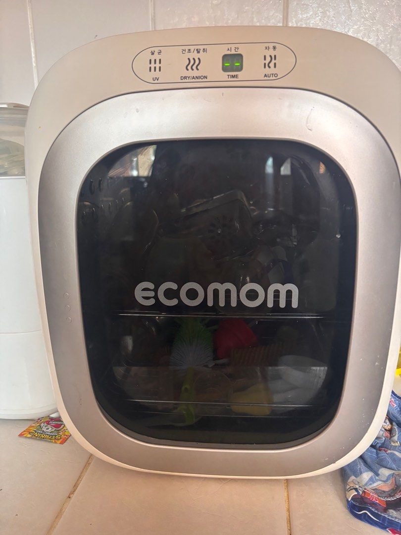 Ecomom UV Sterilizer (Category: Breastfeeding & Bottle Feeding) located in Manila. Submitted by char_g (Listing ID 1416247711, Image 1). Description: - Ecomom UV sterilizer - Functions: UV, Dry, Anion, Time, Auto - Clear door with Ecomom logo - Good working condition - Perfect for sterilizing baby items (bottles, toys, etc.).