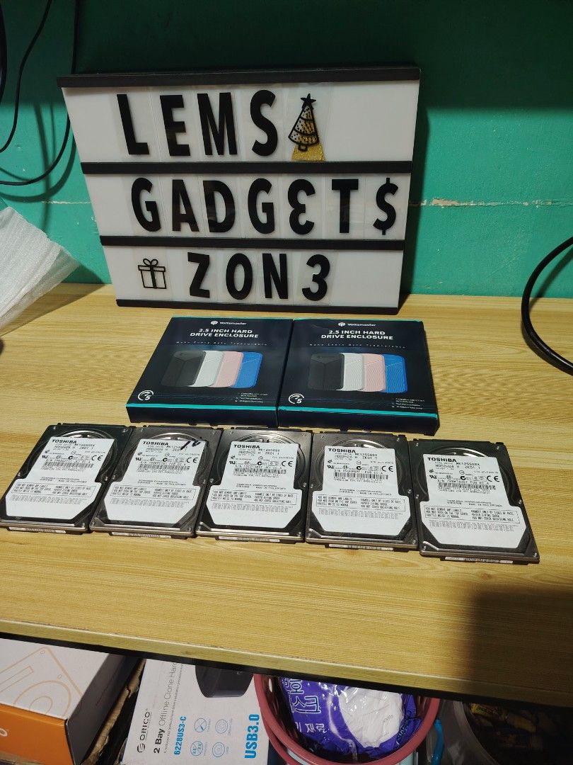 EXTERNAL HDD FULL OF RETRO & PS3 GAMES (Category: Others) located in Manila. Submitted by lemsgadgetszone (Listing ID 1416276567, Image 1). Description: - Five Toshiba MK1655GSX 2.5" hard drives included. - Also includes two 2.5" enclosure boxes. - Manufacturer: Toshiba Corporation. - Model: MK1655GSX - Power: DC 5V 1.0A.