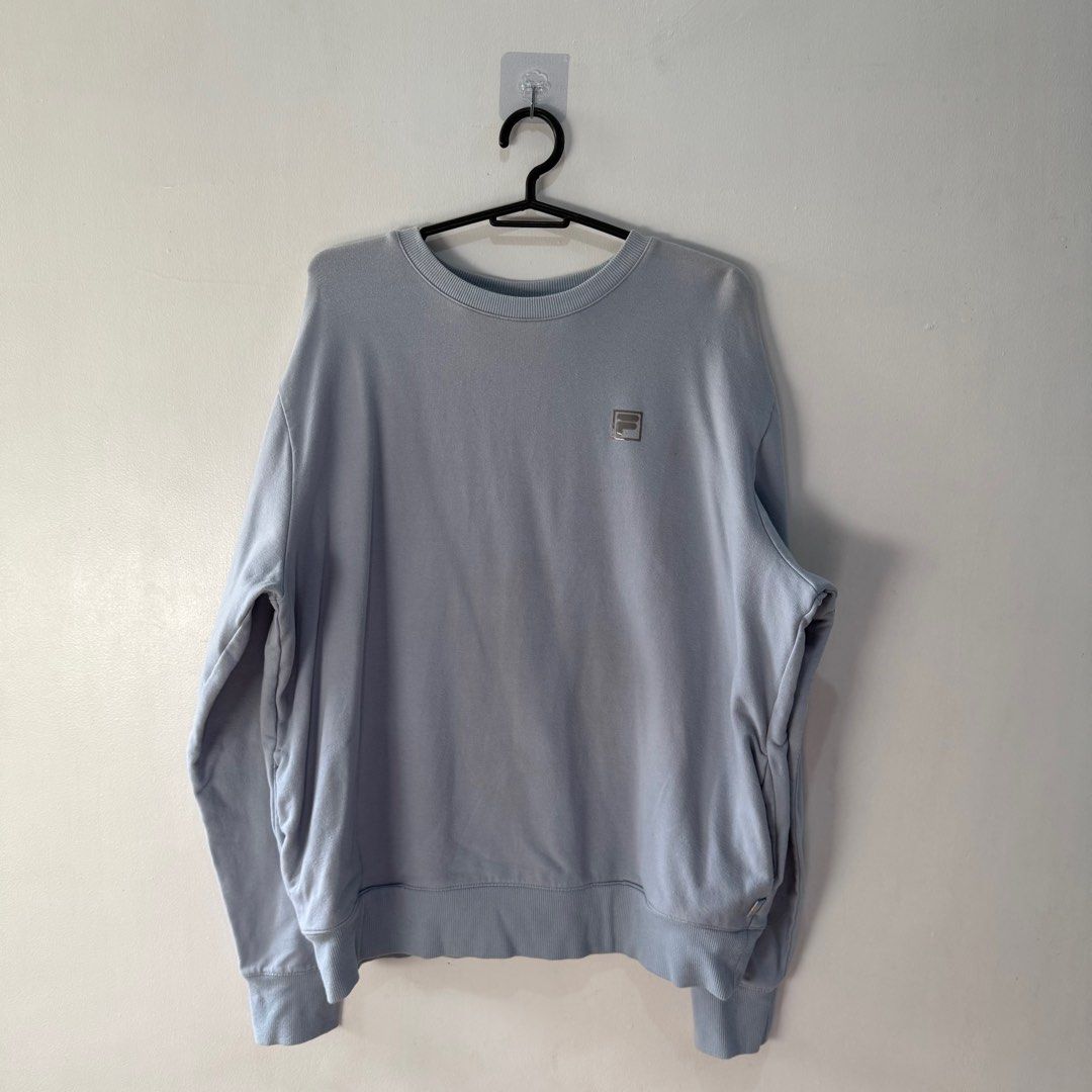 Fila Crewneck Sweatshirt - Light Blue (Category: Coats, Jackets and Outerwear) located in Binan City. Submitted by ard__ (Listing ID 1416307188, Image 1). Description: - Fila crewneck sweatshirt - Light blue color - Size: L - Fila logo on chest - Round neckline - Long sleeves - Material: Cotton blend Pit to Pit: 22 Length: 23 Issue/s: none Price + Shipping fee Shipping via jnt 🍒 Check my other listing for more discount! .
