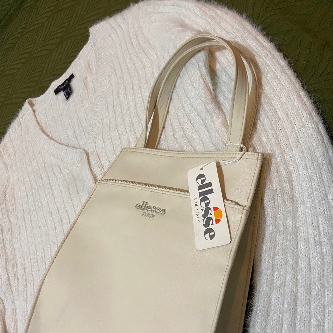 Forever 21 Cardigan & Ellesse Handbag (Category: Coats, Jackets and Outerwear) located in Manila. Submitted by goldenturtle.bfdfc0 (Listing ID 1416221602, Image 3). Description: - Bundle includes: - Cream Forever 21 cropped cardigan (V-neck, button closure) - Cream Ellesse tote bag (with zipper pocket, brand new with tag) - Dimensions: Chest - 19 inches / Length - 18 inches / Shoulder - 16 inches / Sleeves - 26 inches Location : Pasay City Lalamo
