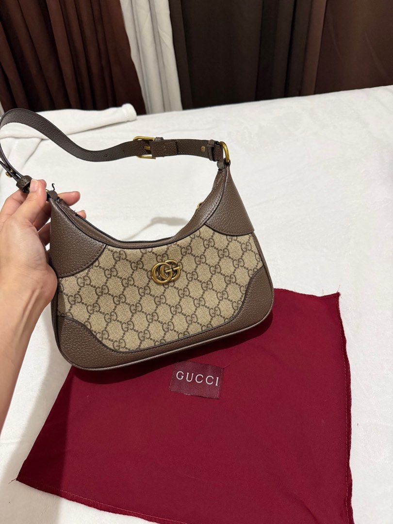 Gucci Jackie 1961 Mini Hobo Bag (Category: Luxury Bags & Wallets) located in Quezon City. Submitted by belle_009627 (Listing ID 1416299089, Image 1). Description: - Gucci Jackie 1961 Mini Hobo Bag - Iconic GG monogram canvas - Brown leather trim - Adjustable shoulder strap - Gold-tone hardware - Includes dust bag.