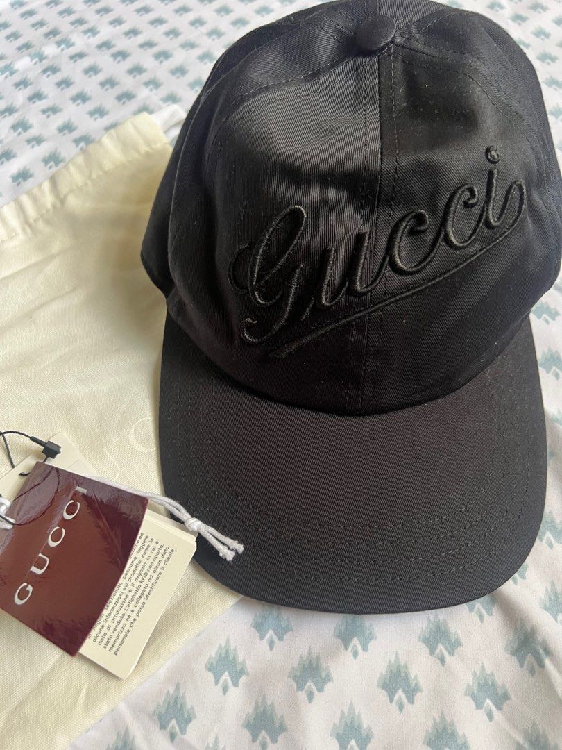 GUCCI logo-embroidered cotton baseball cap (Category: Luxury Accessories) located in Rizal. Submitted by ichaaay21 (Listing ID 1416275659, Image 1). Description: - Authentic Gucci baseball cap - Black color - Embroidered Gucci logo - Size M (58 cm) - Includes dust bag and tags - Made in Italy - Classic design - Bought in Spain.