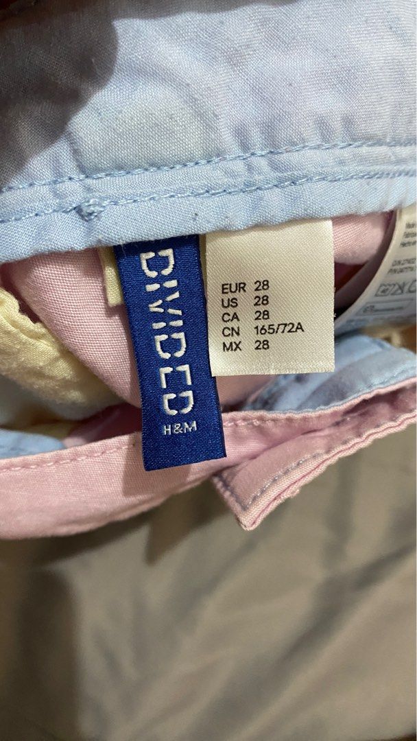 H&M Divided Pink Shorts Size 28 (Category: Shorts) located in Mandaluyong City. Submitted by raffyy (Listing ID 1416381273, Image 2). Description: - H&M Divided pink shorts - Size: 28 - Made in Bangladesh - Features: - Button closure - Pockets - Material: 65% polyester, 35% cotton - Measurements (approximate): - Waist: 16 inches - Length: 20 inches.