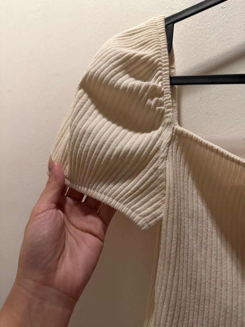 H&M Ribbed Puff Sleeve Top (Category: Blouses) located in Pasig City. Submitted by lovedstuff2020 (Listing ID 1416408759, Image 2). Description: - H&M cream-colored ribbed top - Features puff sleeves and a square neckline - Size: S - Made of soft, ribbed material.