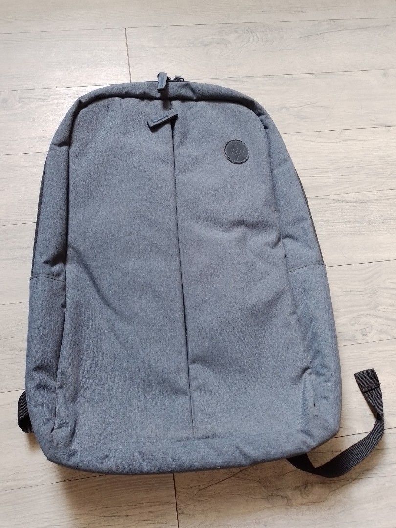 HP Gray Laptop Bag (Category: Laptop Bags & Sleeves) located in Paranaque City. Submitted by metanoia_0315 (Listing ID 1416235767, Image 1). Description: - HP Gray backpack - Minimalist design - Zippered main compartment - Top handle - Adjustable shoulder straps - Durable fabric.