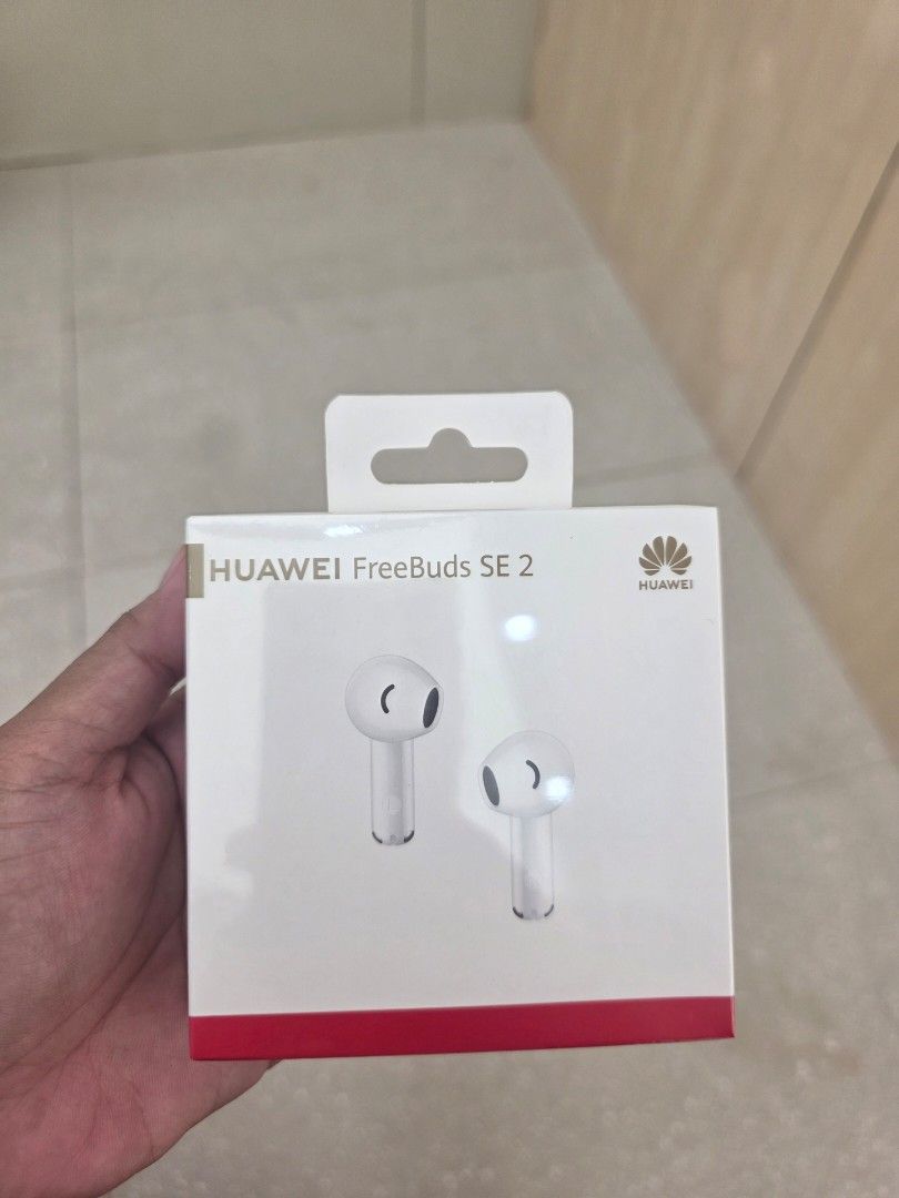 Huawei FreeBuds SE 2 (Category: Earphones) located in San Fernando. Submitted by reggy_888 (Listing ID 1416342076, Image 1). Description: Huawei FreeBuds SE 2 in white. Features Bluetooth connectivity. Includes a charging case. Model number is AM1711. Color is Crystal White. The charging case model is 70616L. The box contains the earbuds and charging case..