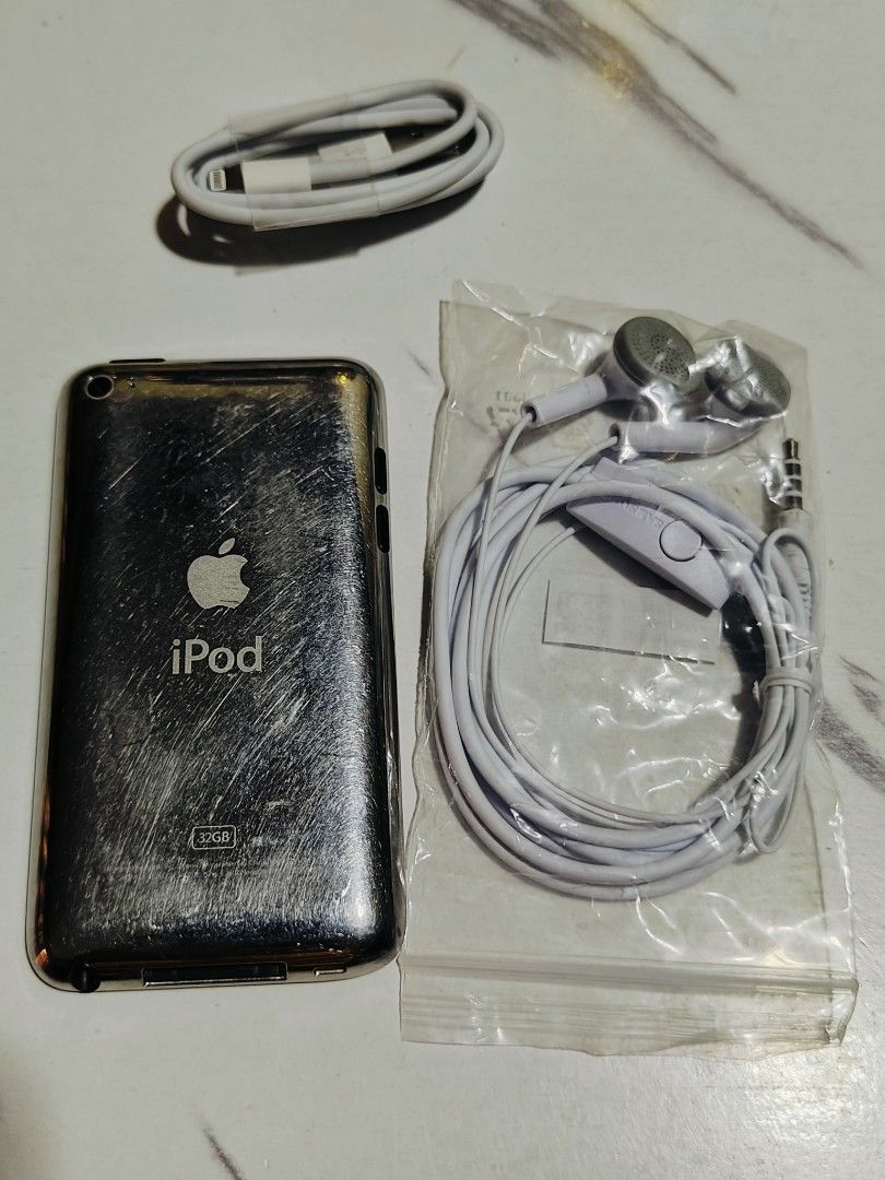 iPod touch 4- 32gb White (Category: Portable Music Players) located in Quezon City. Submitted by jkionaire17 (Listing ID 1416269053, Image 3). Description: 🎧📱 CLASSIC APPLE DEAL – iPod touch 4th Gen 📱🎧 iPod touch 4 • 32GB ✔️ 85% smooth unit ✔️ All working ✔️ With games installed 🎮 ✔️ 1,000 Spotify songs + music videos 🎶📽️ ⚠️ Screen has slight dark spot in the middle but not noticeable during use 💸 For only ₱1,799 — super sulit for music l