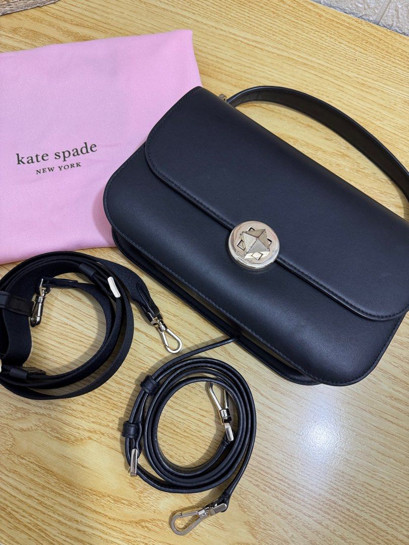 Kate Spade Black Shoulder Bag (Category: Luxury Bags & Wallets) located in Castillejos. Submitted by jmb_preloved (Listing ID 1416346257, Image 1). Description: Please see photos to see minor flaws (scratches) SUPER GANDA NITO!! 🥹 -Authentic Kate Spade shoulder bag - Flap closure - Silver-tone star-shaped clasp - Includes two detachable straps: - Wider fabric strap - Thinner leather strap - Comes with Kate Spade dust bag - Single interior compar