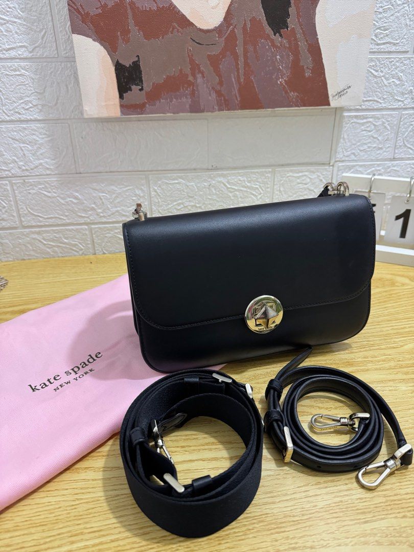 Kate Spade Black Shoulder Bag (Category: Luxury Bags & Wallets) located in Castillejos. Submitted by jmb_preloved (Listing ID 1416346257, Image 2). Description: Please see photos to see minor flaws (scratches) SUPER GANDA NITO!! 🥹 -Authentic Kate Spade shoulder bag - Flap closure - Silver-tone star-shaped clasp - Includes two detachable straps: - Wider fabric strap - Thinner leather strap - Comes with Kate Spade dust bag - Single interior compar