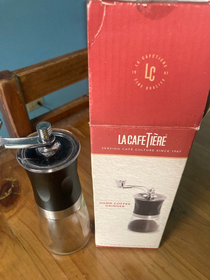 La Cafetiere Hand Coffee Grinder (Category: Coffee Machines & Makers) located in Antipolo. Submitted by ibskikayshop (Listing ID 1416253207, Image 2). Description: La Cafetiere hand coffee grinder features adjustable ceramic grinders for coarse, medium, or fine granules. It has an ergonomic design for easy manual grinding and a built-in glass jar. The box indicates it has been serving cafe culture since 1967..